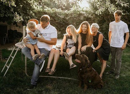 Image of Volodymyr Zhukov (right) with his family at home in Kyiv, Ukraine.