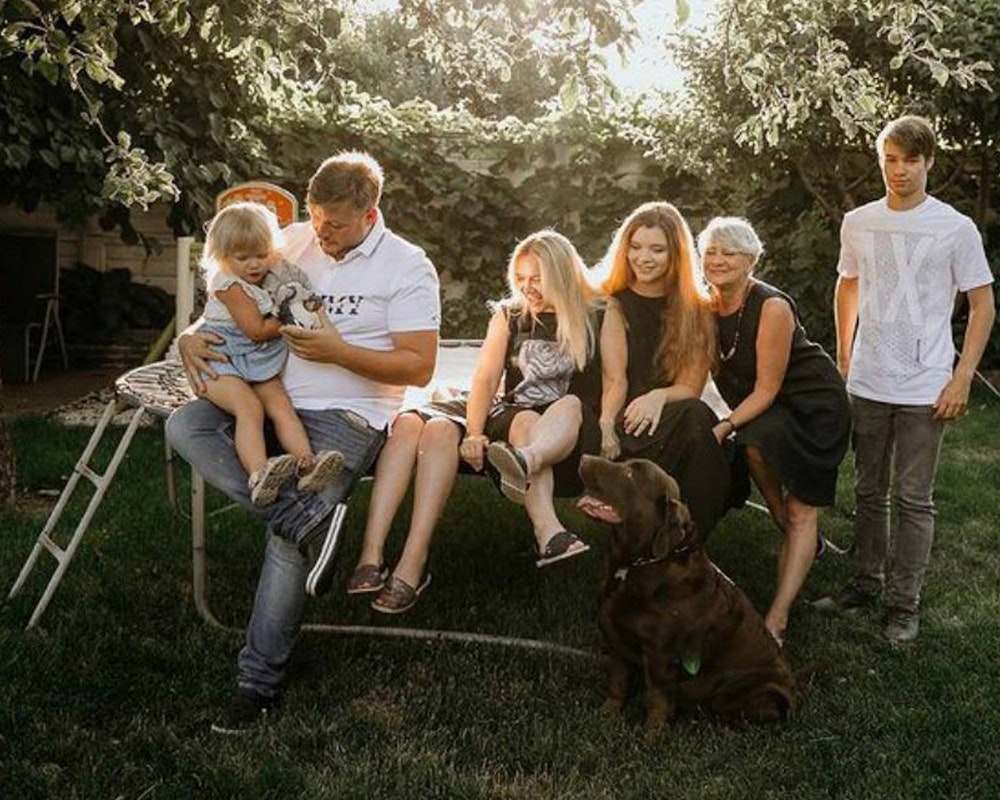 Image of Volodymyr Zhukov (right) with his family at home in Kyiv, Ukraine.