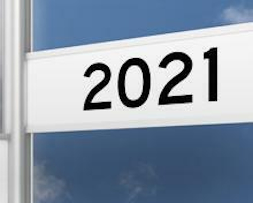 Signpost reading "2021" against a blue sky