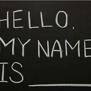 "Hello, my name is ____" written with chalk on a blackboard