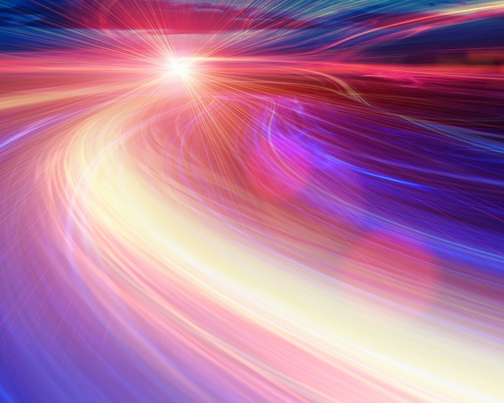 Swirling multi colored lights depicting Bandwidth in the abstract